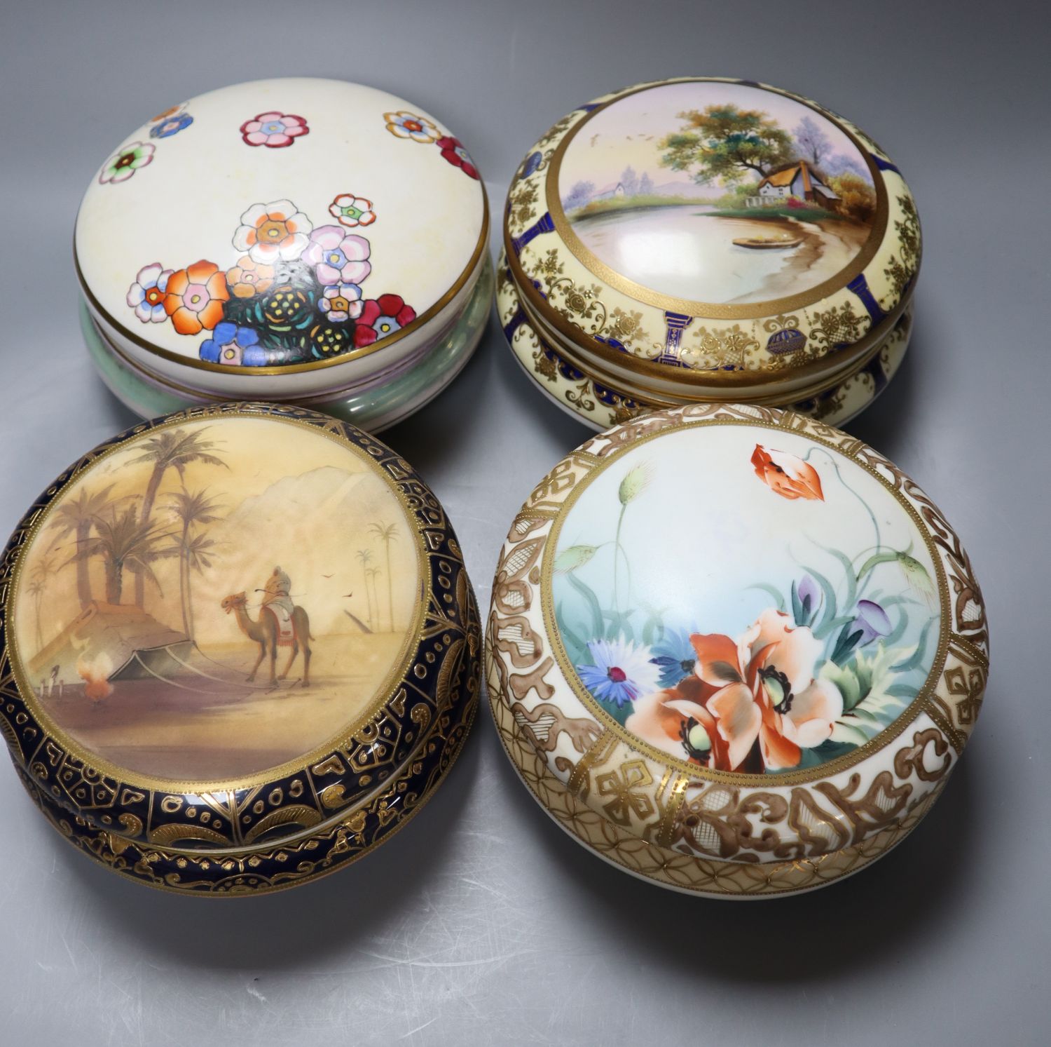 Four Japanese porcelain bowls and covers, two by Noritake, 17cm